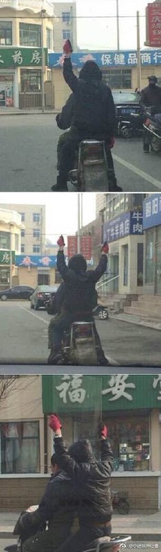 路上遇见一哥们一直举着手
